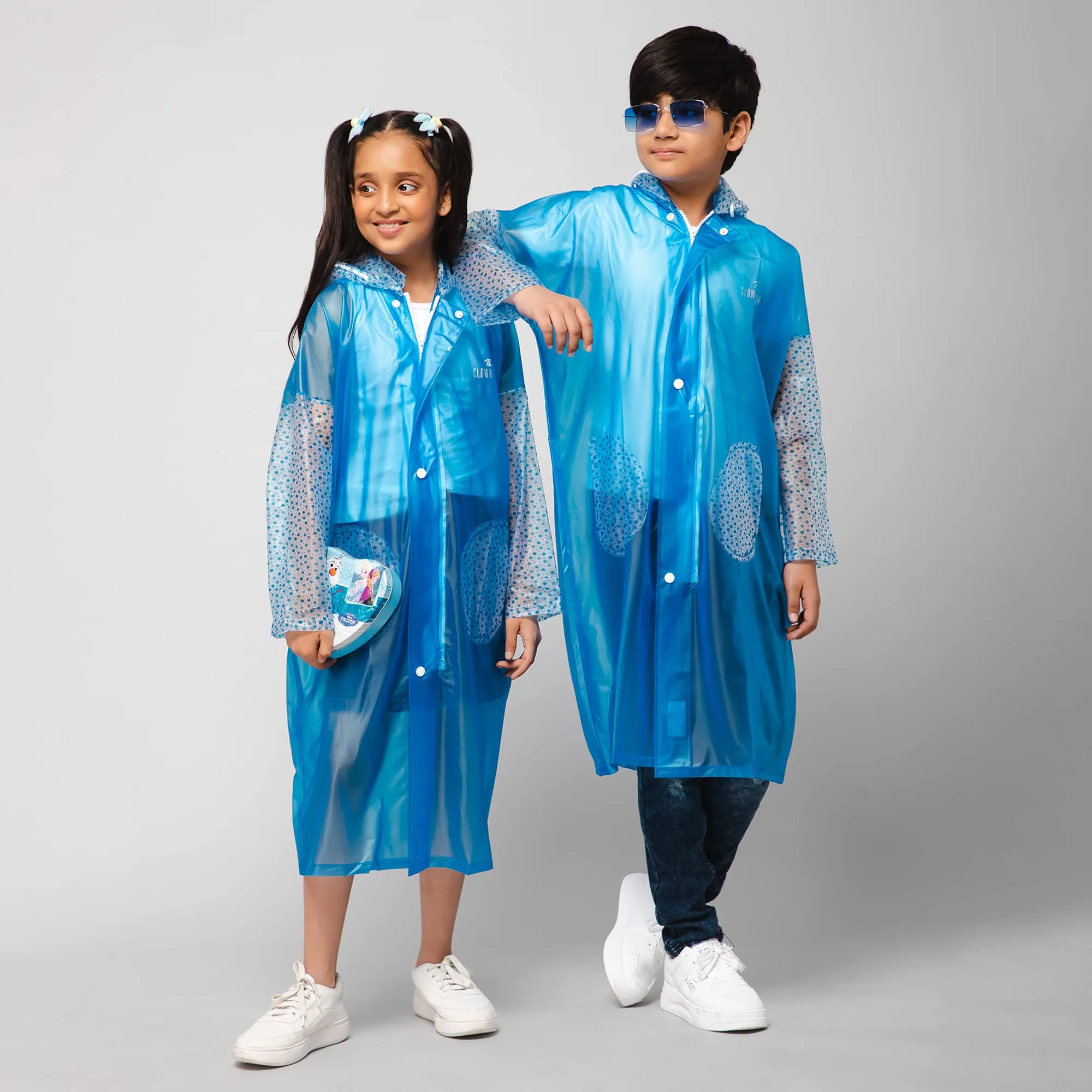 THE CLOWNFISH Storm Shield Series Unisex Kids Waterproof Single Layer PVC Longcoat/Raincoat with Adjustable Hood. Age-13-14 Years (Transparent White)